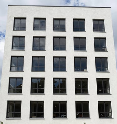 Exterior of a newly constructed commercial building with clean lines and professional signage.