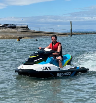 a happy renter enjoying riding on one of our jetski