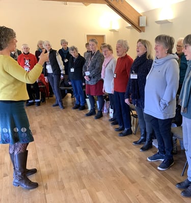 Claire leading the Tenors