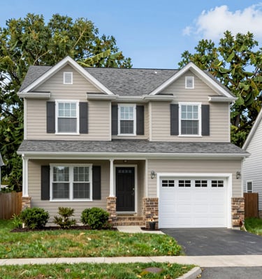A freshly completed modern residential home with clean lines and a welcoming porch.
