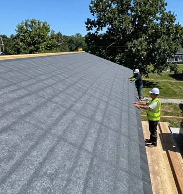 A beautifully maintained commercial building exterior with landscaping and fresh paint.