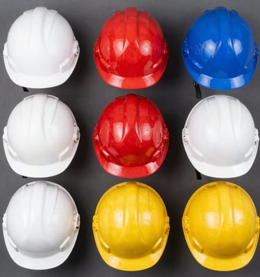 Close-up of industrial helmets stacked neatly in a warehouse.