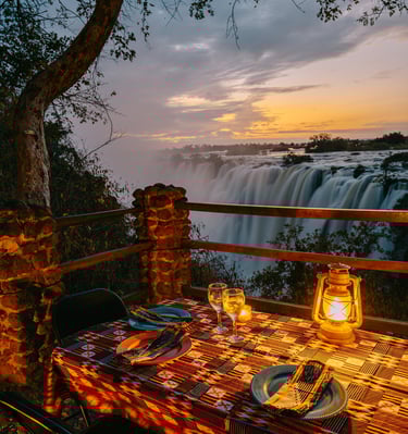 dining at sunset overlooking the Victoria Falls