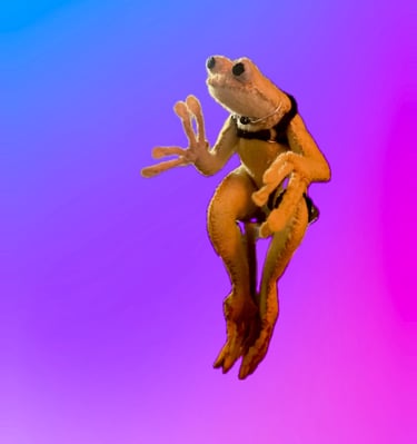 yellow sewn felt frog wearing ball gag, chest harness and thigh harness