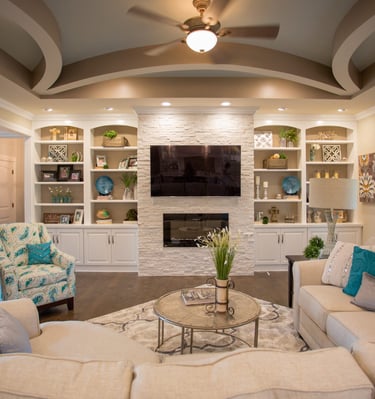 Cozy custom living room with fireplace and built-in shelves in Kane County home