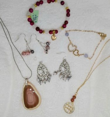 a variety of jewelry and jewelry on a white surface