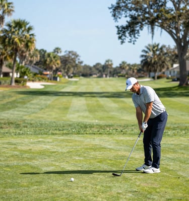 A graceful older gentleman reviewing travel plans with a concierge, surrounded by navy blue and gold accents.