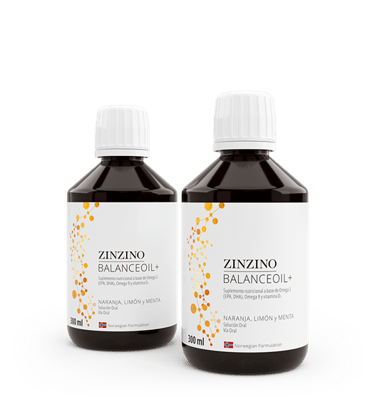 Two amber bottles of Zinzino BalanceOil+ omega-3 supplement with orange, lemon, and mint flavors.