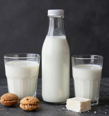 An assortment of golden-brown baked cakes decorated with fresh fruit toppings.