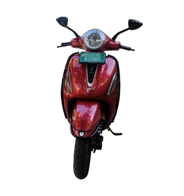 Front view of a red electric scooter with a green license plate, isolated on a white background.
