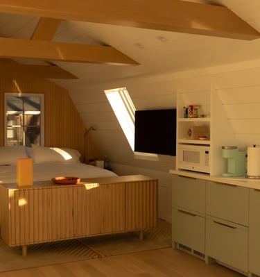 a bedroom with a bed and a television