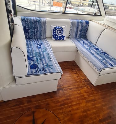 a couch with a blue and white couch and a compass compass