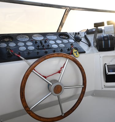a steering wheel of a boat with a steering wheel