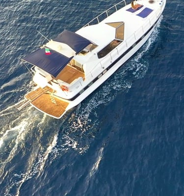 a boat with a blue sky and a boat in the water