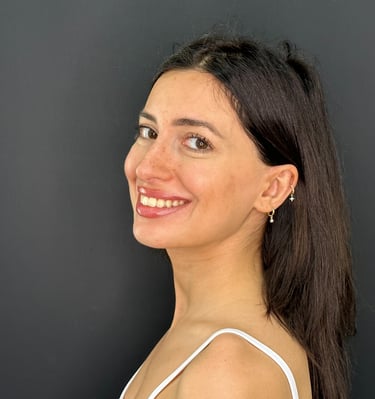 Patient smiling with natural white teeth after cosmetic dental treatment in Tbilisi