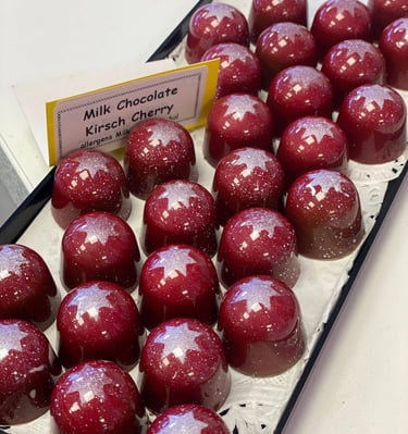 Kirsch Cherry Bon Bons, milk chocolate with alayer of cherry pate de fruit and a cherry ganache