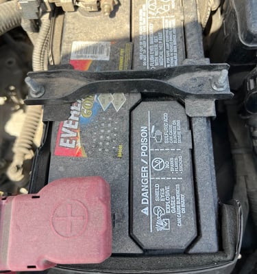 a car battery box with a battery and a battery