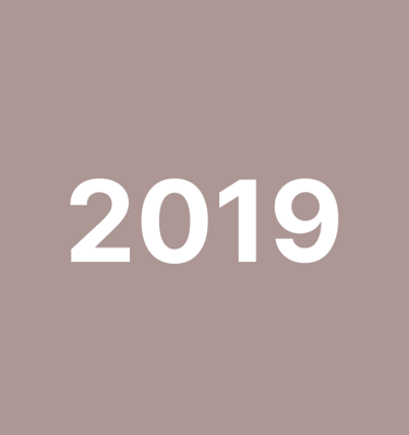 Dancers in colorful costumes performing a festive Latin dance.