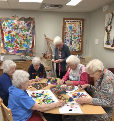 boy in green shirt holding black round plastic container
