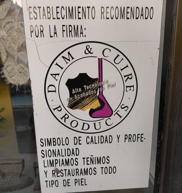 a sign that says that we're specialists in cleaning leather and skins