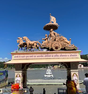 Statue of a Shri Krishna and Arjun on rath at Parmarth Ashram in Rishikesh, near the Ganges River