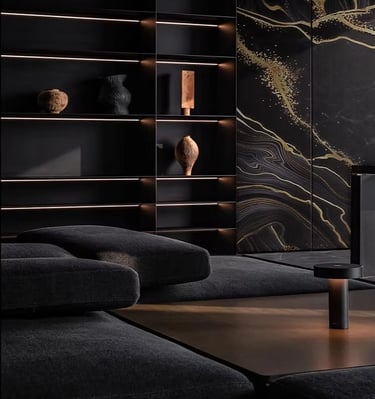 Luxury modern living room with black backlit shelving, marble wall art, and a plush dark sofa.
