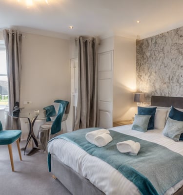 a bedroom with a bed and a chair