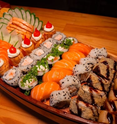 a long boat shaped plate with sushi and sushi