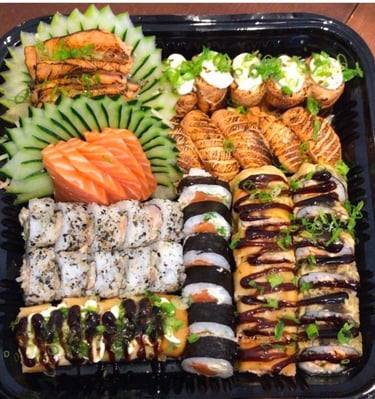 a tray of food that includes sushi and sushi