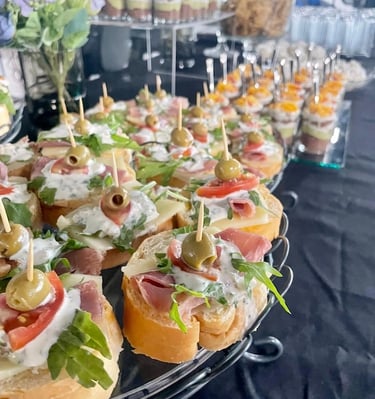 a tray of food with olives and olives
