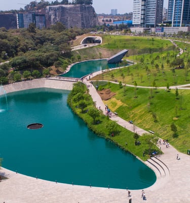 a large pond with a fountain and a fountain