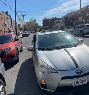a car parked in a parking lot with a number plate