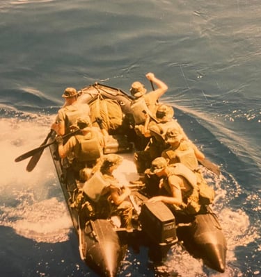 Marine Raiders debarking shipt with paddles out