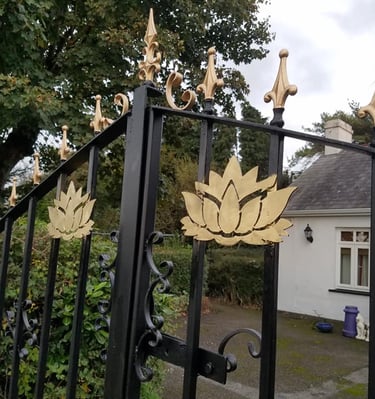 Golden spear top gates with floral design