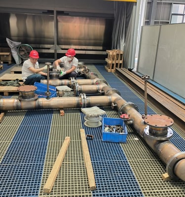 PMI Piping workers are assembling pipes 