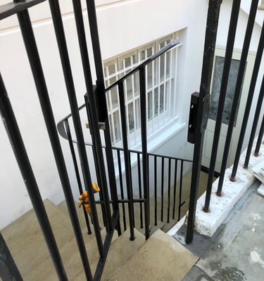 a black and white staircase with a black railing
