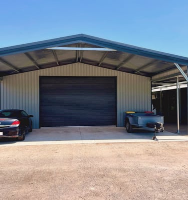 A custom build shed with a car parked in front