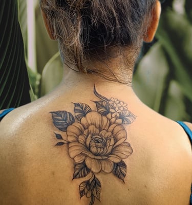 a woman with a tattoo on her back