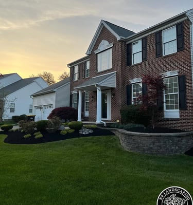 excellent landscaping and hardscaping of grass, stones and trees by NP Landscaping