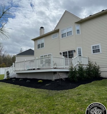 excellent landscaping and hardscaping of grass, stones and trees by NP Landscaping