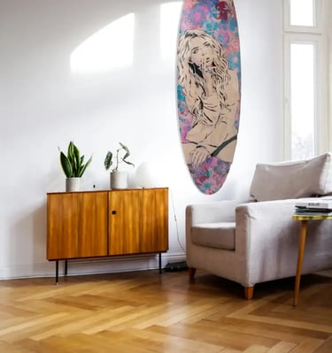 livingroom with Efin surfboard art on wall