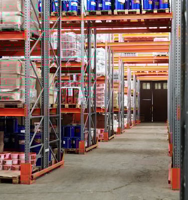 a warehouse style warehouse with a lot of boxes and boxes