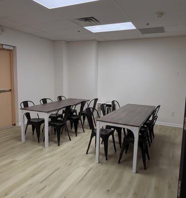 Empty event room with table and chairs