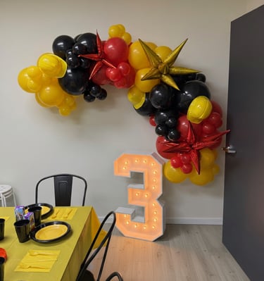 Birthday with balloon arch and marquee letter