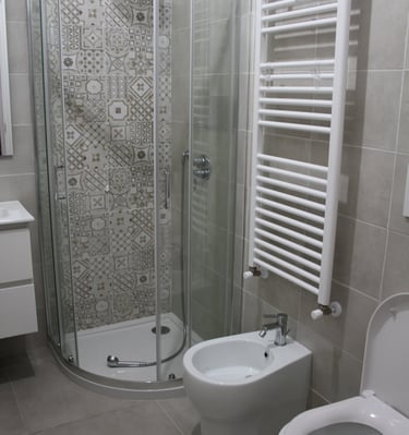 lodgings in sardinia a bathroom with a toilet and a shower