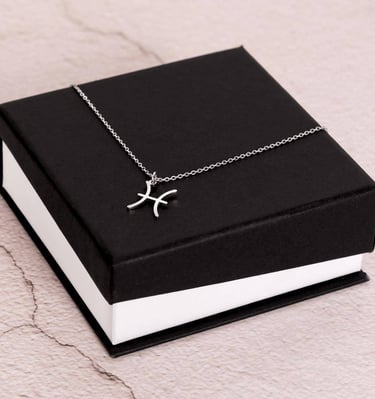 a black box with a silver cross on it