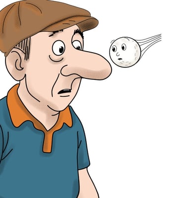 golf ball flying past the nose of a man in a cap