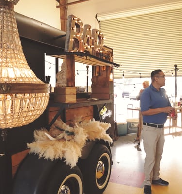 horse trailer bar with men in front