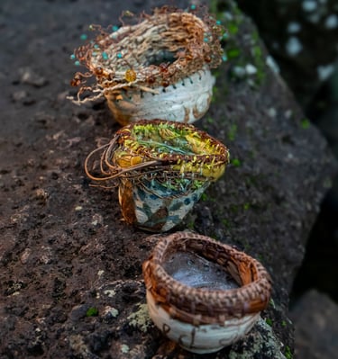 a collection of 3 woven top ceramic bowls