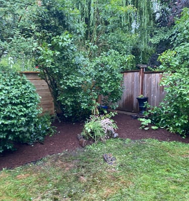mulched flower bed with rocks